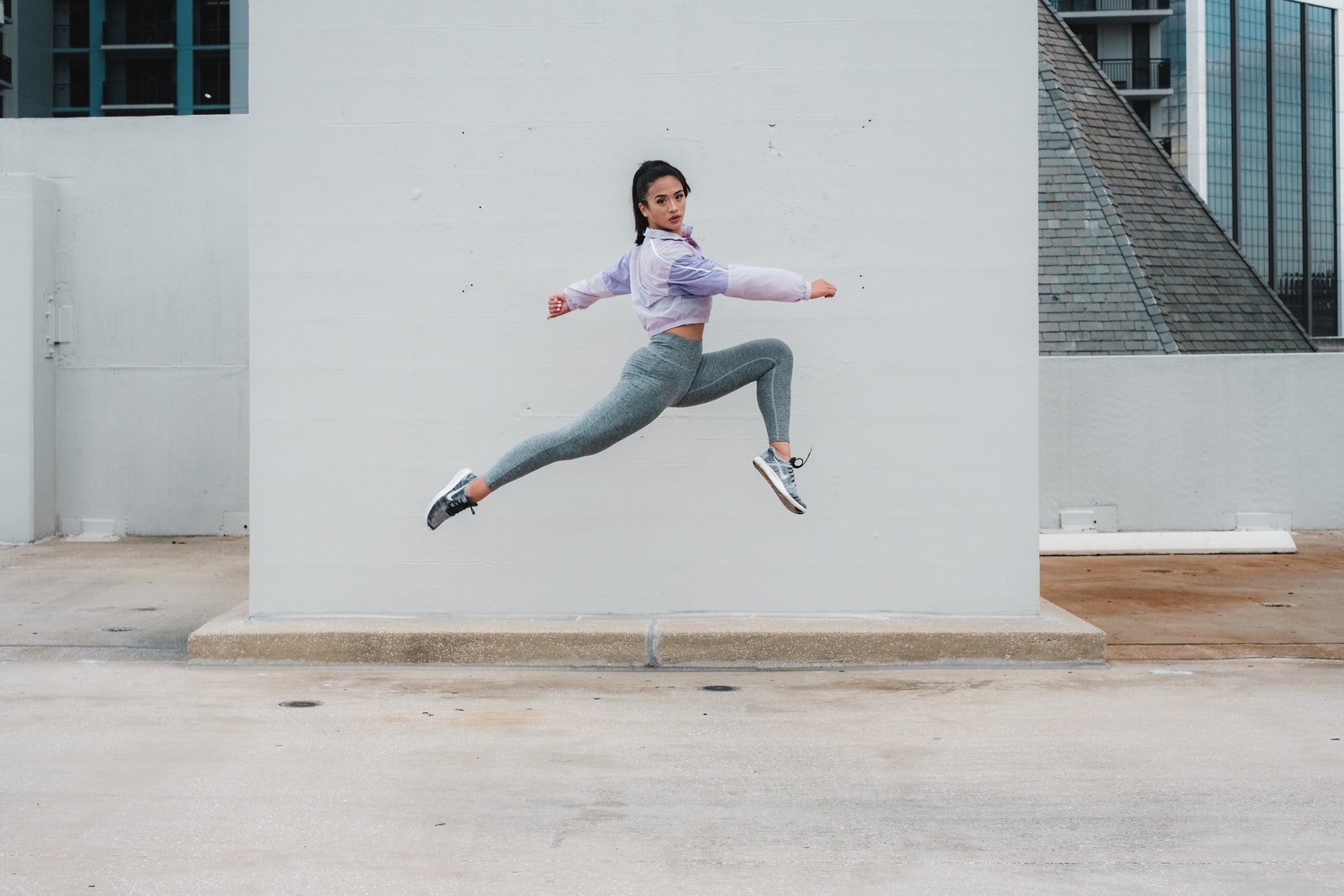 A Jump Shot of a Woman Wearing Activewear