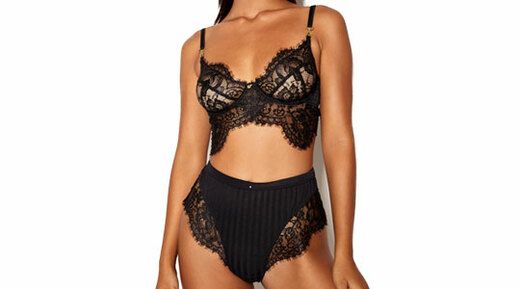 Woman wearing black gooseberry intimates bliss longline bra and high-waist panty