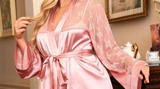 Woman in living room wearing pink SHEIN Plus Contrast Lace Belted Satin Night Robe