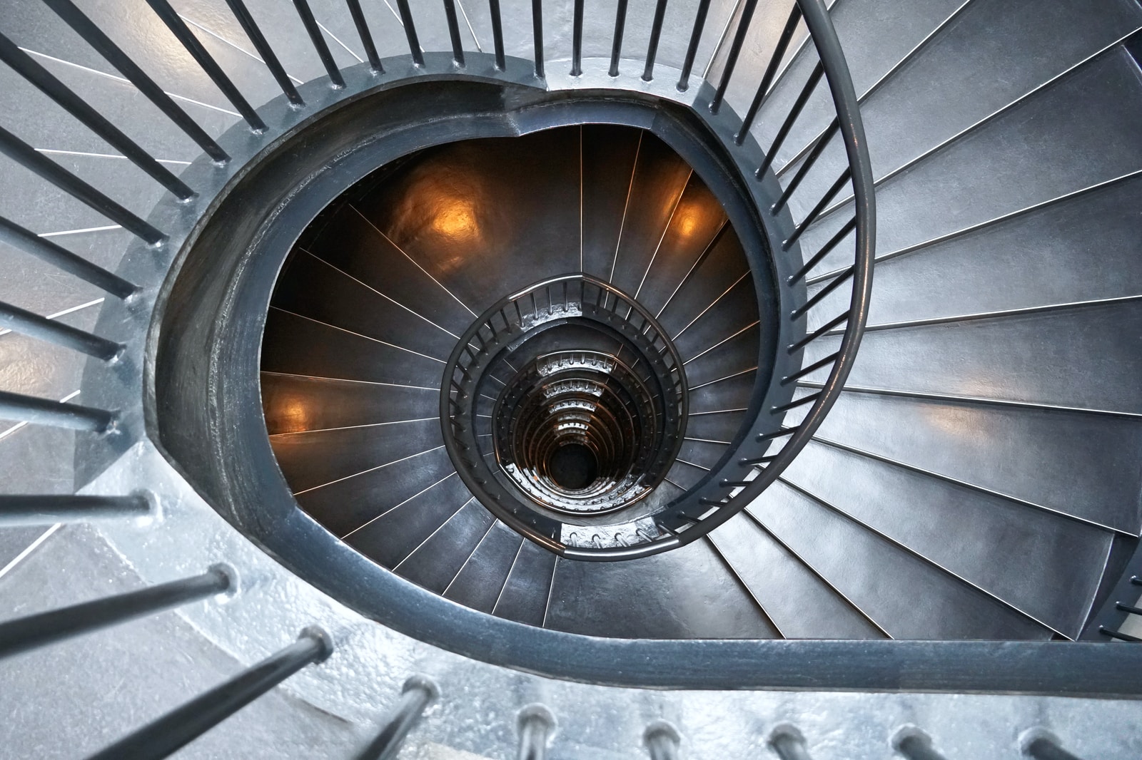 gray concrete spiral stairs with no people