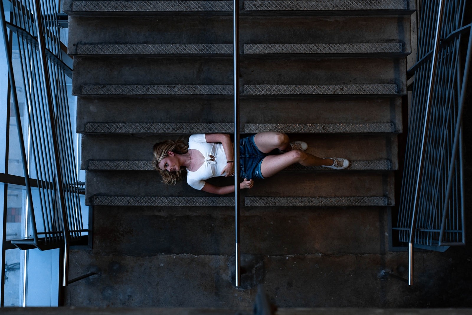 woman lying on stairs